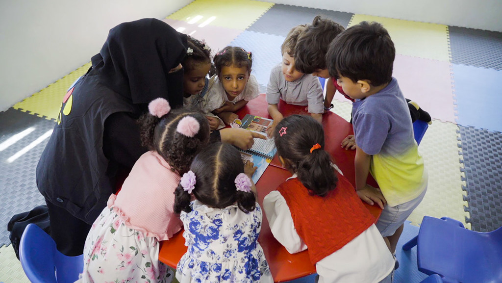 Children play with locally made educational toys in Yemen.